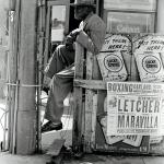Man outside a liquor store in Oakland, California, 1962 Man outside a liquor store in Oakland, California, 1962